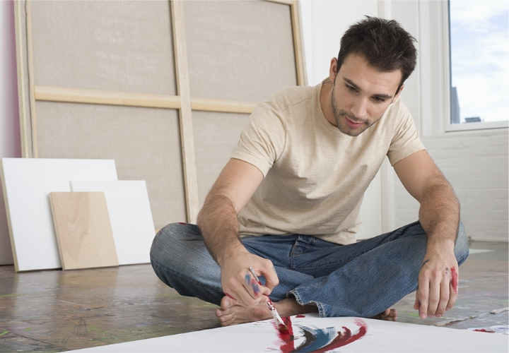 Man sitting and painting