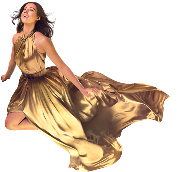 Woman in gold dress floating in mid air amongst the clouds